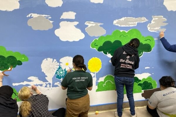 AmeriCorps Volunteers Painting A Mural