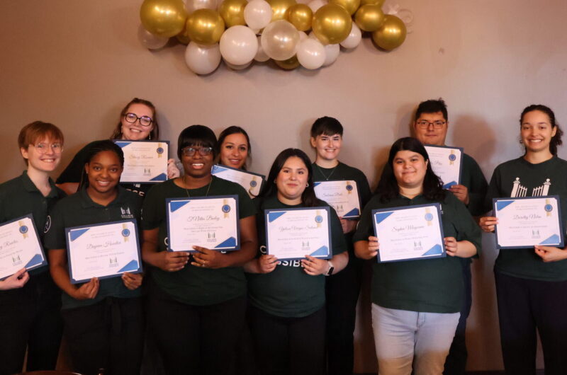 Group Photo Of 2022-2023 AmeriCorps Members At End Of Year Celebration. Members Are Holding Superlative Awards. From Left To Right: Aubrey, Dayana, Stacey, Maria, Yulissa, Sabrina, Sophia, Emilio, And Dorothy.