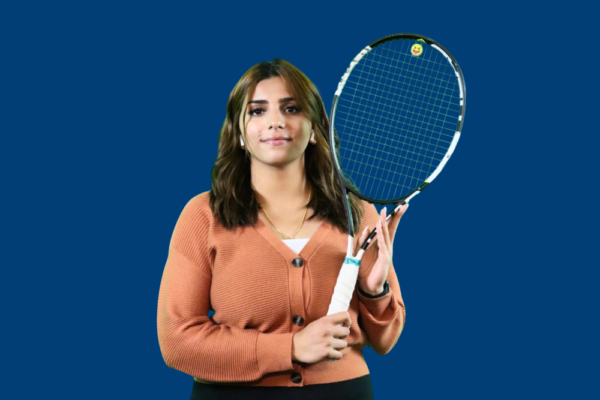 Student Malak Holding A Tennis Racket.