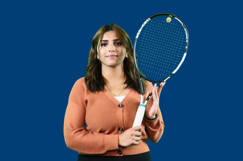 Student Malak Holding A Tennis Racket.