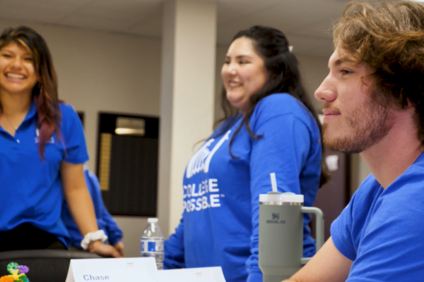Side Profile Of AmeriCorps Coaches Smiling At Unknown Person
