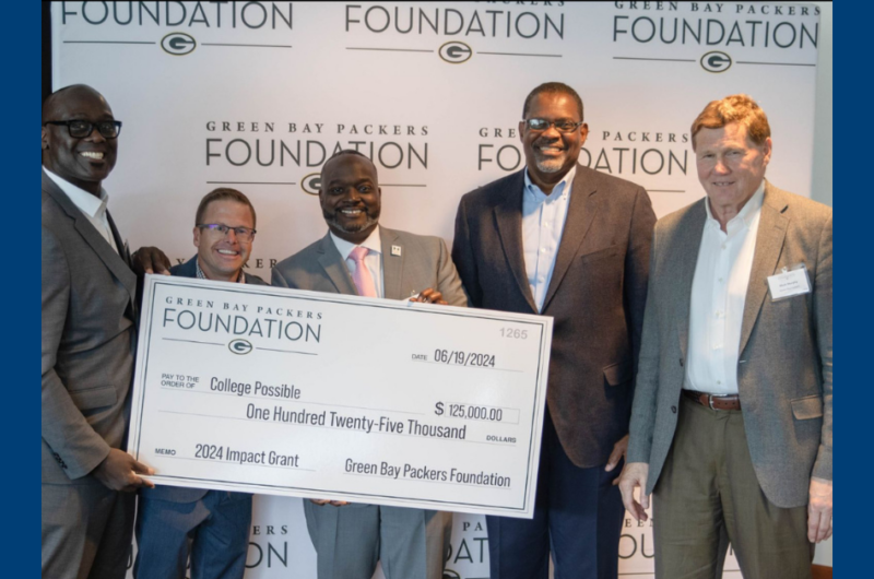 Five Men Smiling Holding A Green Bay Packers Foundation Check