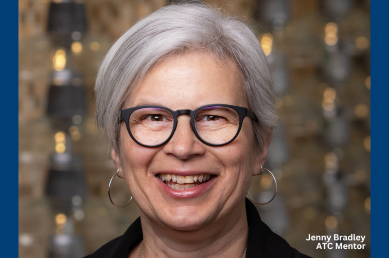 Woman With Short Gray Hair And Glasses Smiling