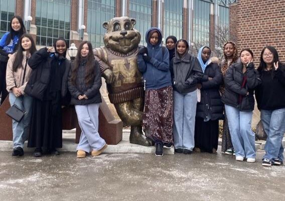 Group Of Students Standing Next To The Goldy Gopher Statue At The University Of Minnesota.