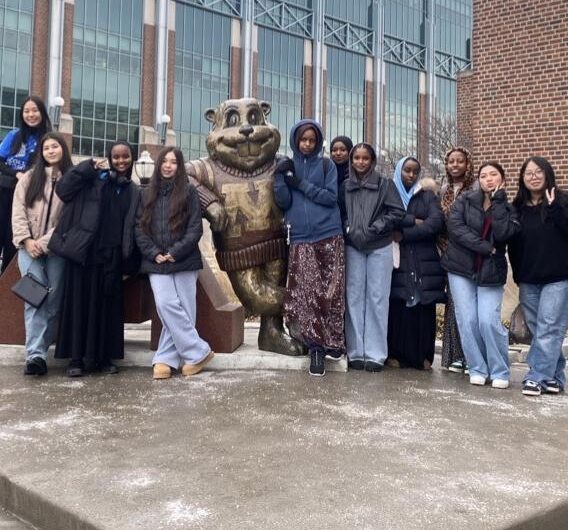 Group Of Students Standing Next To The Goldy Gopher Statue At The University Of Minnesota.