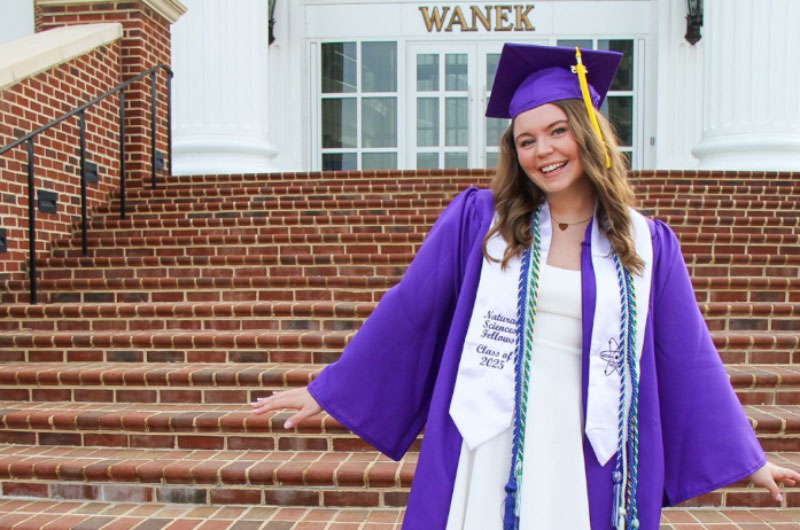 Sienna in cap and gown
