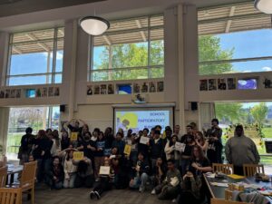 A group of students at Parkrose High School pose for a photo after an assembly.