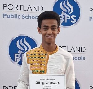 College Possible student poses with an award.